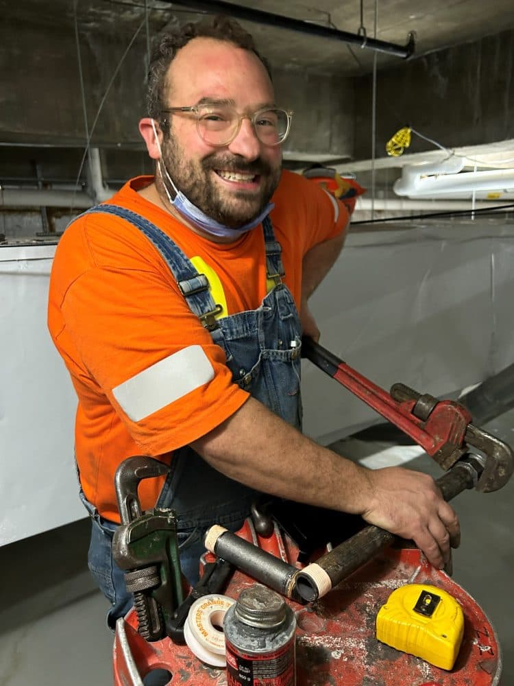 Charles of 18 Plumbing threading pipe on site